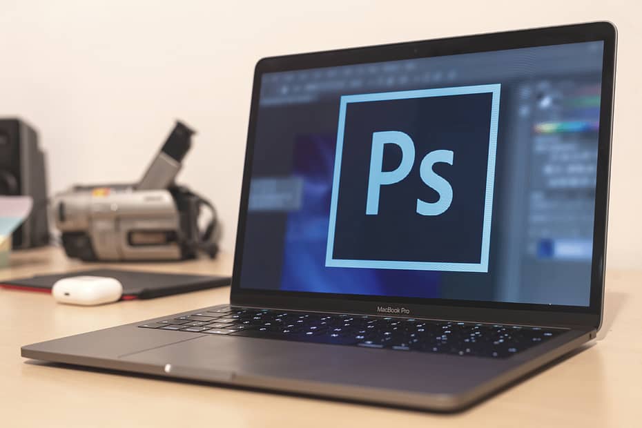 Picture of a laptop with photoshop software open promotion of the Photoshop 1 class.